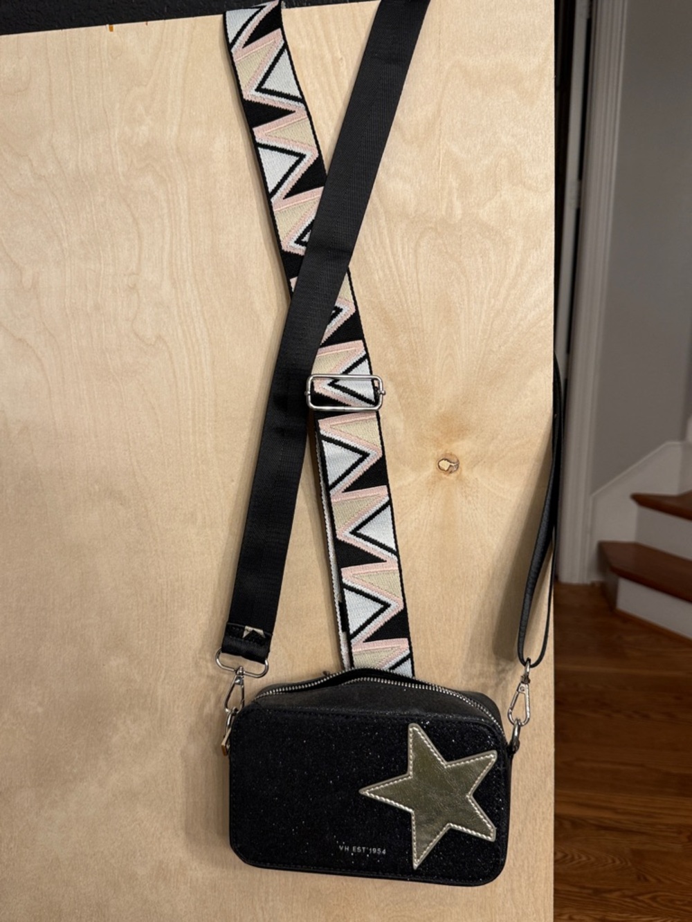 Black Crossbody Bag with Olive Star Accent and Patterned Strap